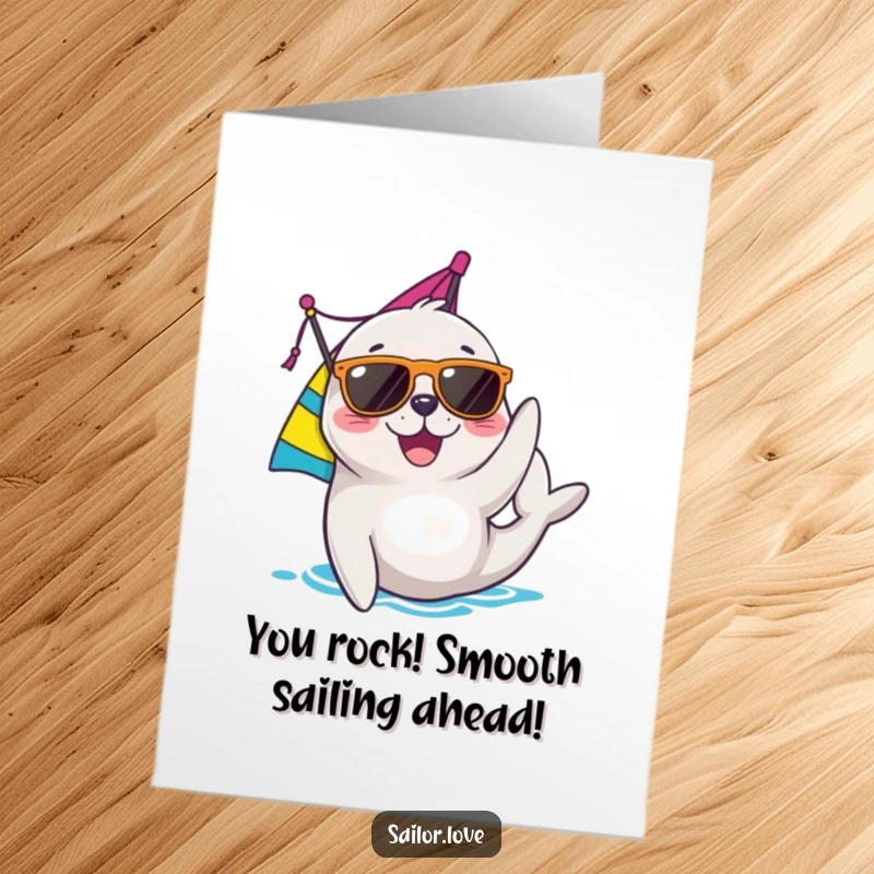 Funny Free Printable Congratulations Card: Seal wearing sunglasses adjusts a colorful sail, signifying smooth sailing to success.
