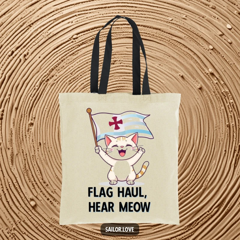 Funny Tote Bag: A happy cat unfurls a nautical flag, making it a charming and humorous carry-all.