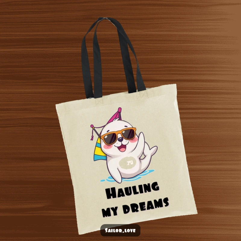 Funny seal tote bag with a joyful character in sunglasses adjusting a sail, ideal for beach trips and sailing enthusiasts.
